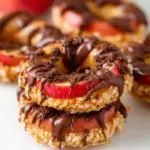Apple Samoas topped with toasted coconut and chocolate drizzle on a platter