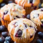 Freshly baked Blueberry Muffins with Lemon Glaze on a wire cooling rack