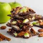 A tray of sliced Caramel Apple Bark with layers of chocolate and caramel