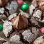 Freshly baked Chocolate Blossom Cookies on a wire rack with chocolate drops in the center