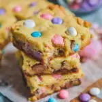 A pan of soft yellow Easter Cake Mix Cookie Bars topped with pastel candies and sprinkles.