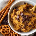 A bowl of scoopable Edible Pumpkin Cookie Dough with mini chocolate chips