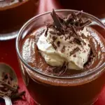 A glass of Gordon Ramsay's Dark Chocolate Mousse with a light, airy texture and chocolate shavings.