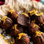 A plate of Healthy Dark Chocolate Orange Truffles dusted in cocoa powder