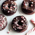 A tray of fudgy healthy peppermint hot cocoa brownies topped with toasted white marshmallows and crushed candy canes.