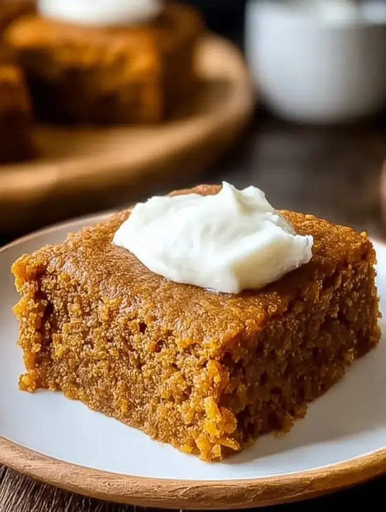 A stack of sliced Healthy Pumpkin Bars with dark chocolate chips on a wooden board