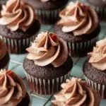 A batch of moist Mini Chocolate Cupcakes on a wire cooling rack
