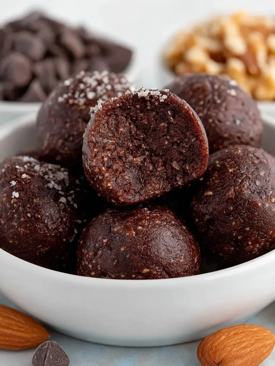A plate of round No Bake Brownie Bites dusted with cocoa powder