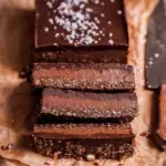 A square of No-Bake Nutella Fudge Bars showing the thick hazelnut ganache layer and graham cracker base