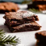 A stack of sliced Paleo Gingerbread Blondies showing a fudgy and dense interior texture.
