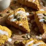 Freshly baked Paleo Pumpkin Scones on a parchment lined baking sheet
