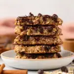 A tray of freshly baked Peanut Butter Banana Oatmeal Cookies with melted chocolate chips
