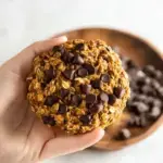 A tray of freshly baked Pumpkin Chocolate Chip Oatmeal Cookies on a wire rack.