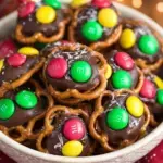 A tray of freshly made Rolo Pretzels with M&M Candies showing the melted chocolate and colorful toppers