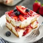 A beautiful dish of Strawberry Tiramisu with layers of ladyfingers and fresh berries.