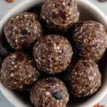 Healthy Turtle Energy Balls made with pecans and dates on a parchment lined tray