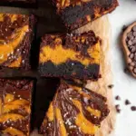 Sliced Vegan Pumpkin Cheesecake Brownies showing chocolate and pumpkin layers