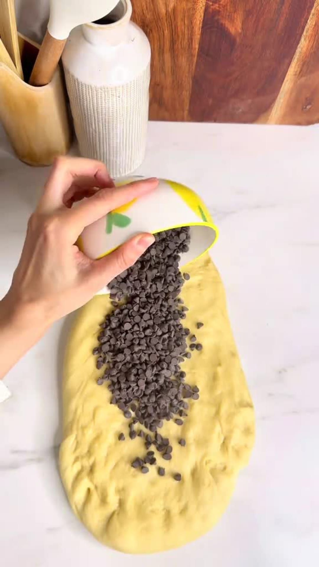 Fluffy Chocolate Chip Braided Brioche - Adding chocolate chips to dough