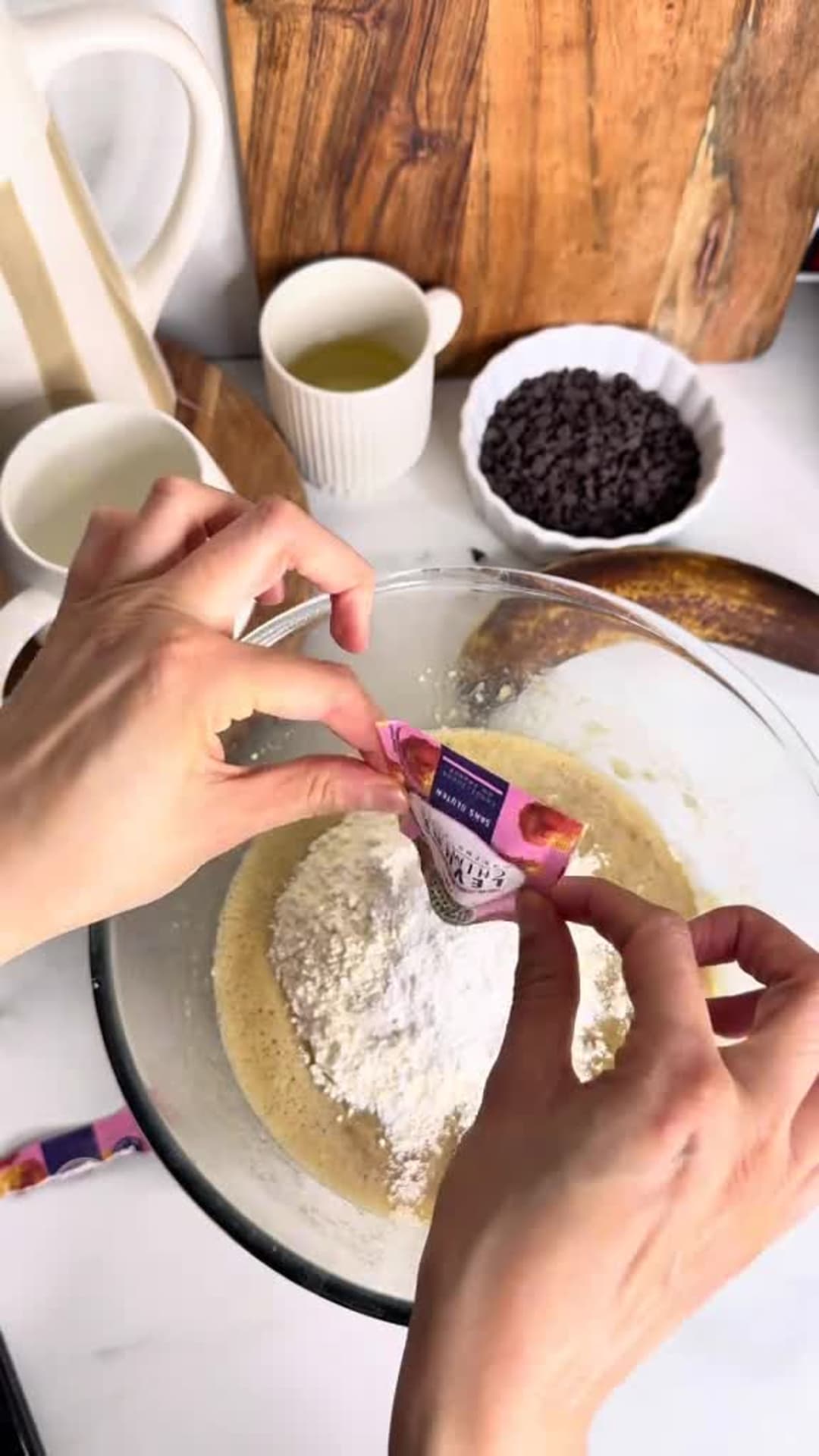 Moist Chocolate Chip Banana Bread - Adding flour, baking powder, and salt