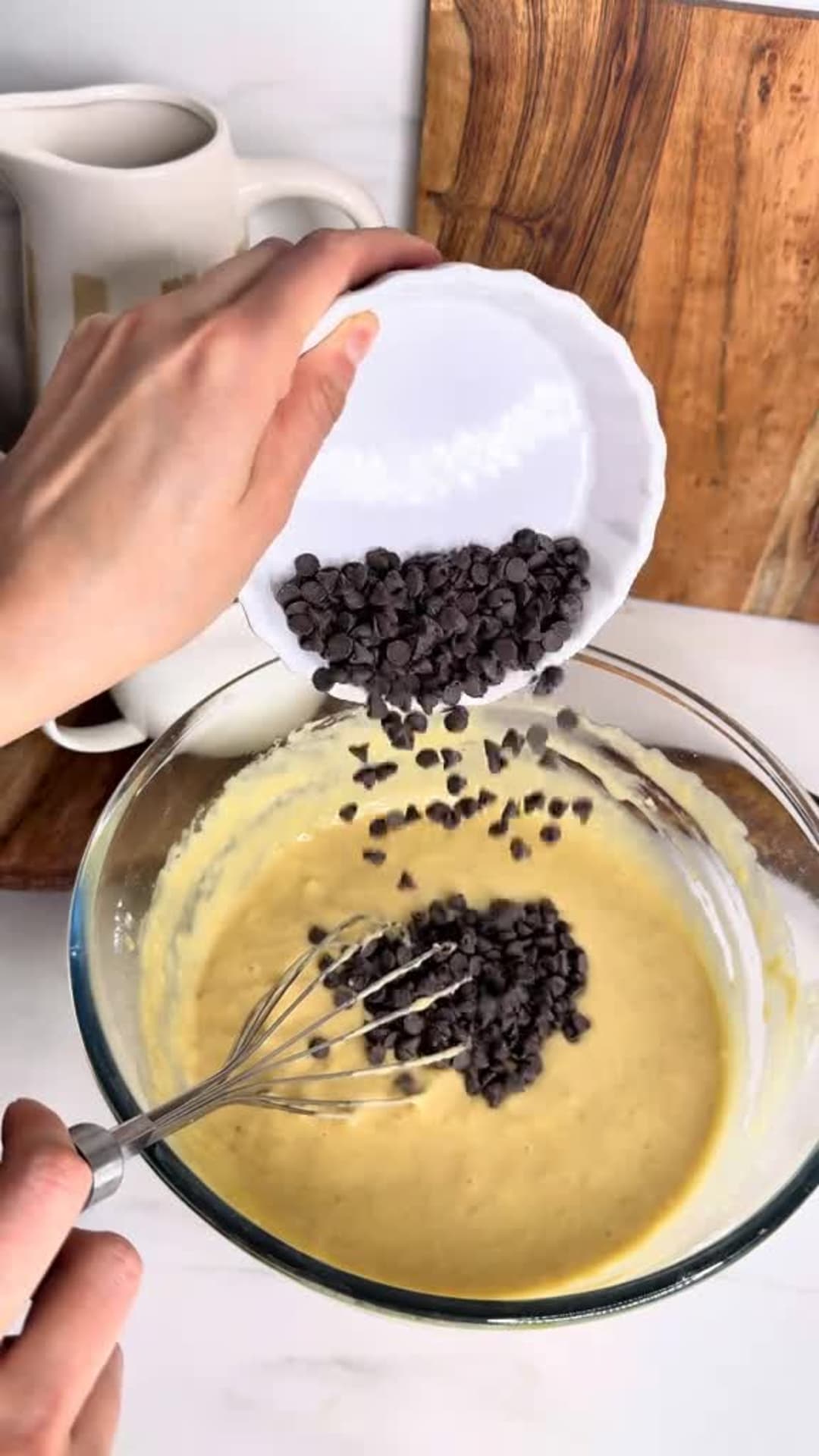 Moist Chocolate Chip Banana Bread - Folding chocolate chips into banana batter
