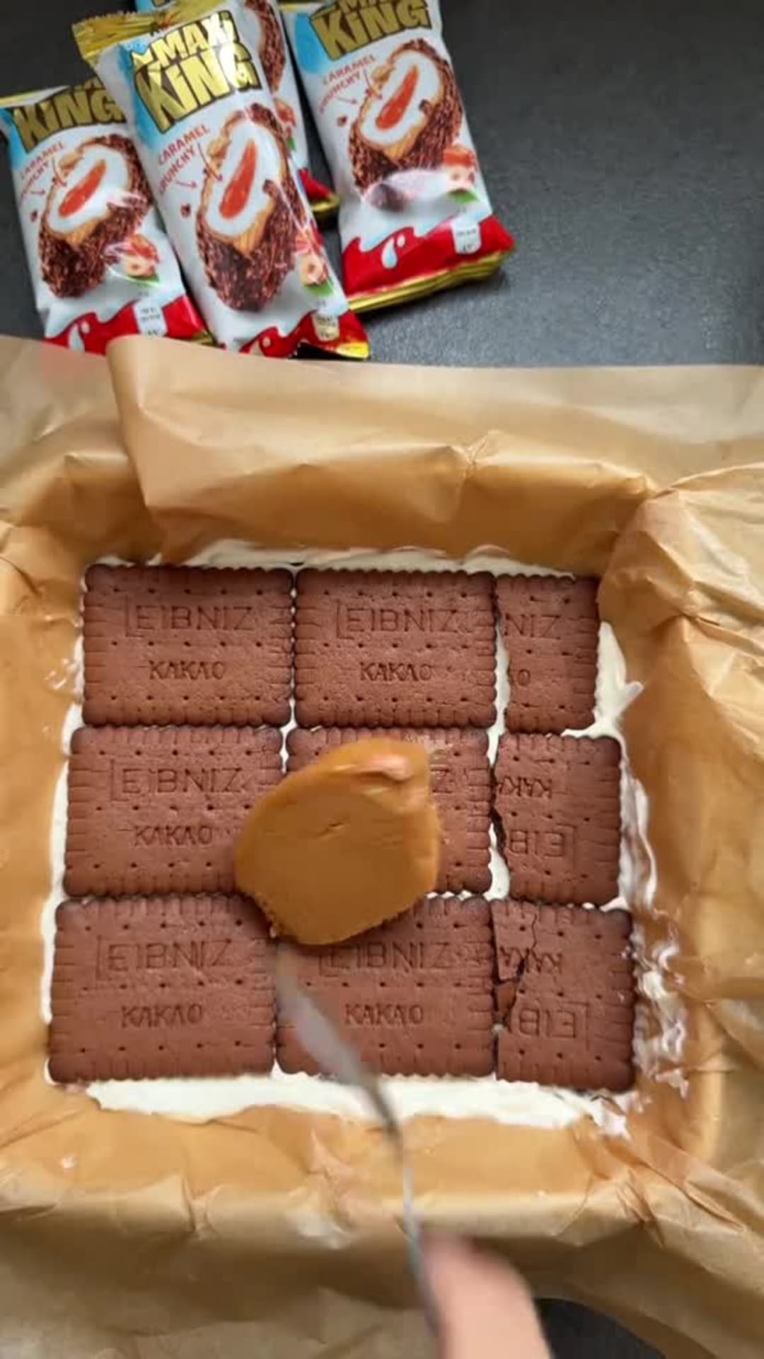No-Bake Kinder Max King Cake - Spreading caramel layer