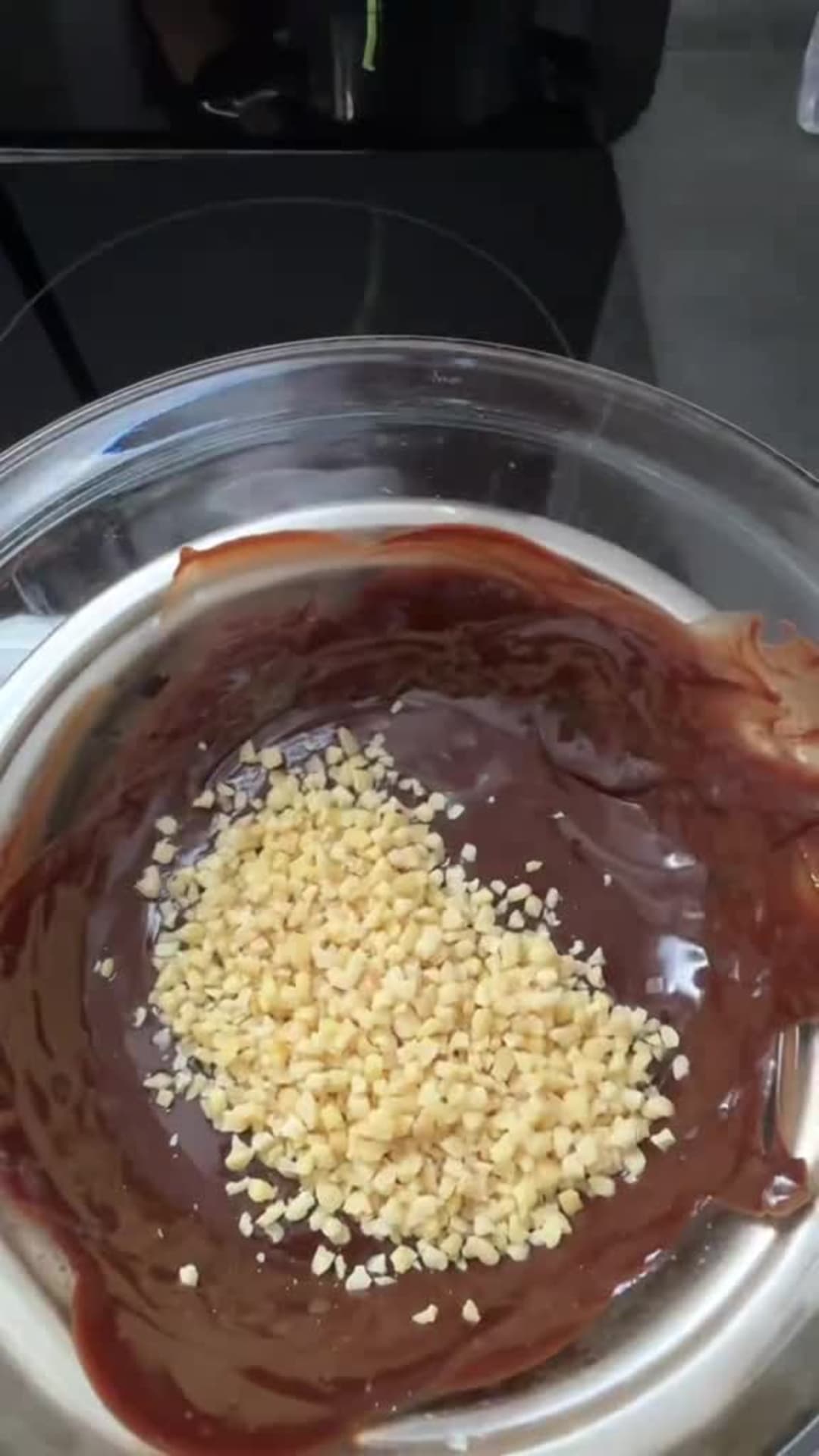 No-Bake Kinder Max King Cake - Mixing hazelnut chocolate glaze