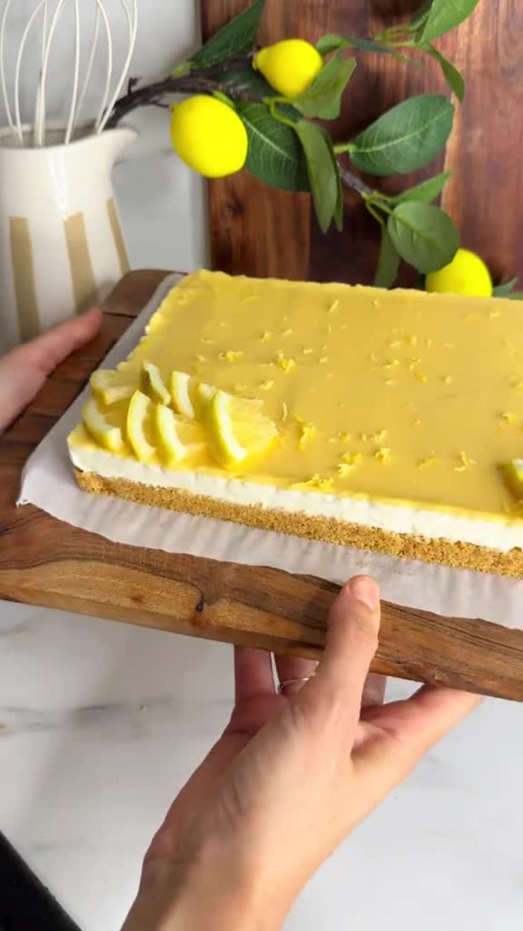 No-Bake Lemon Cheesecake Bars - Spreading lemon curd over cheesecake