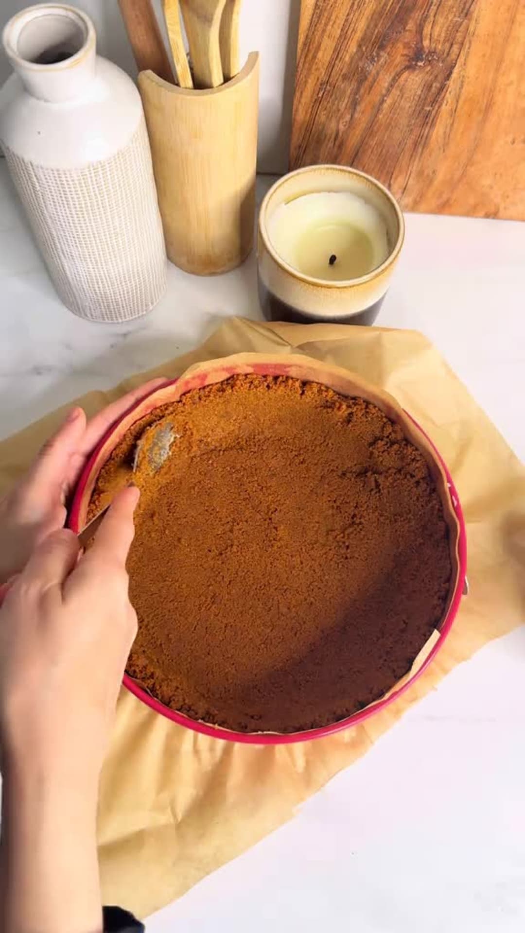 No-Bake Speculoos Tiramisu Cheesecake - Pressing crust into springform pan