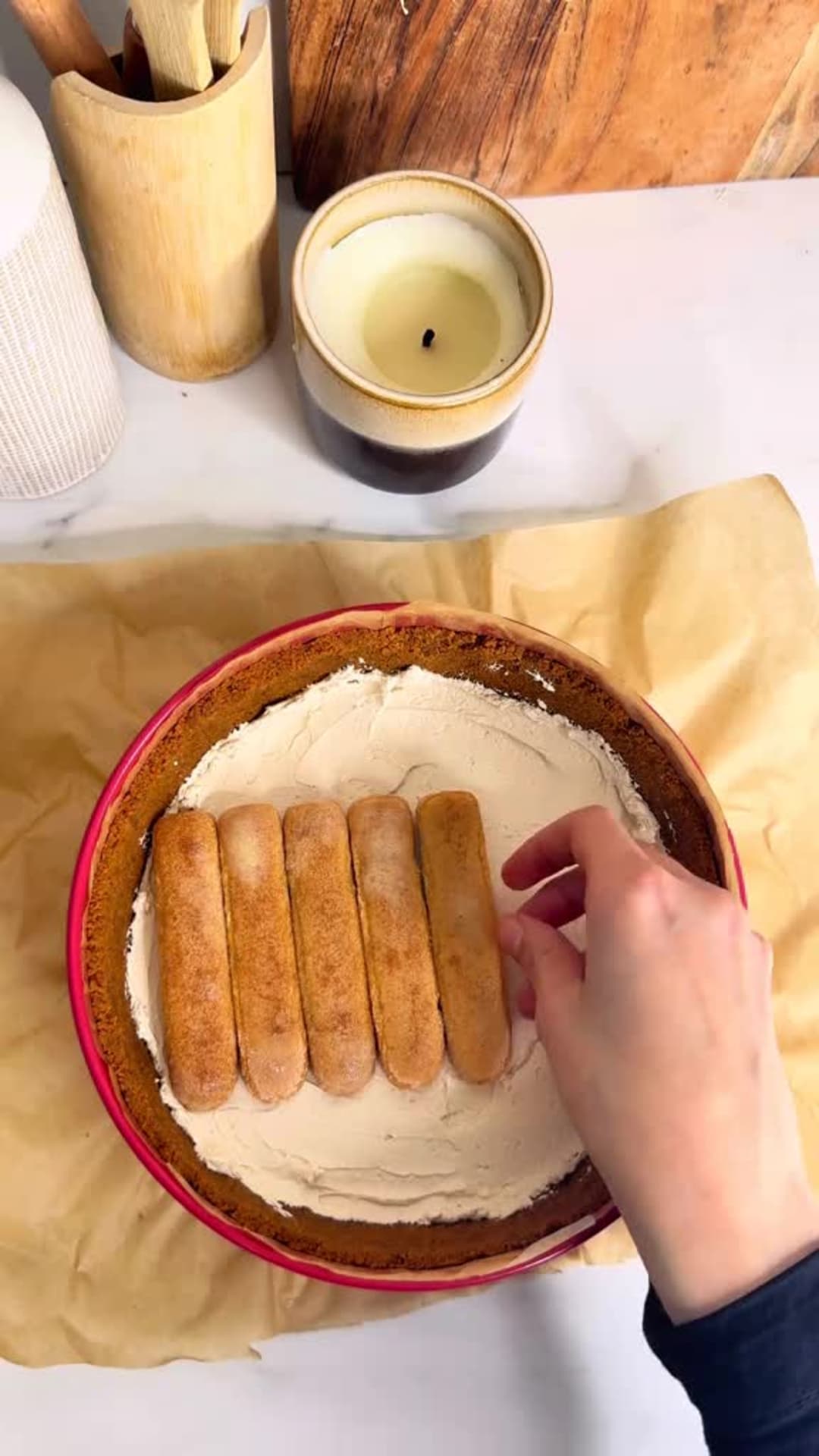 No-Bake Speculoos Tiramisu Cheesecake - Adding coffee soaked ladyfingers